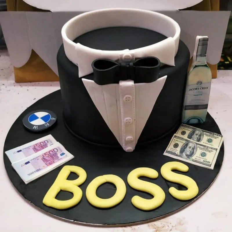 he Big Boss Fondant Cake with Taxido and Bow Tie design, available for delivery in Noida, East Delhi, and South-East Delhi.